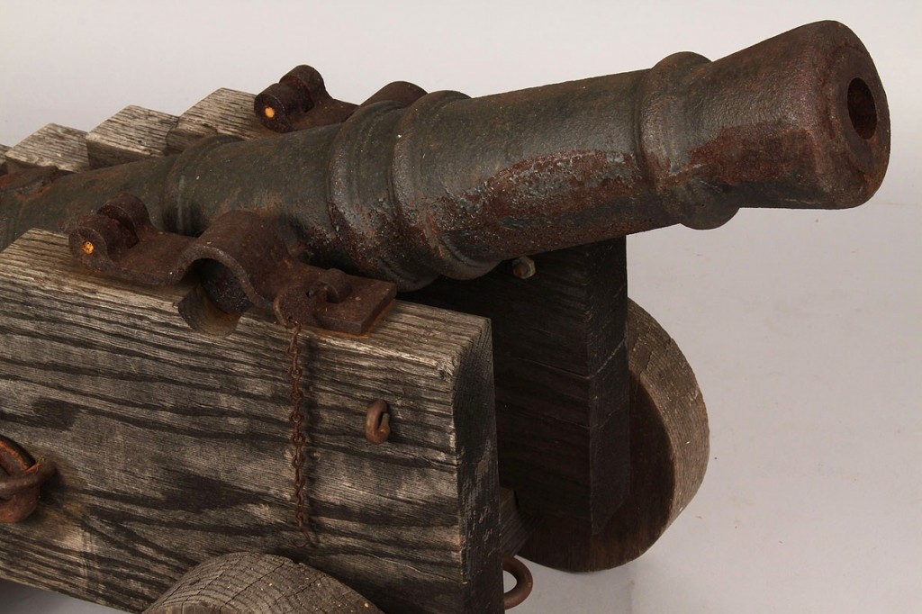 Lot 519: Small Iron cannon with oak carriage