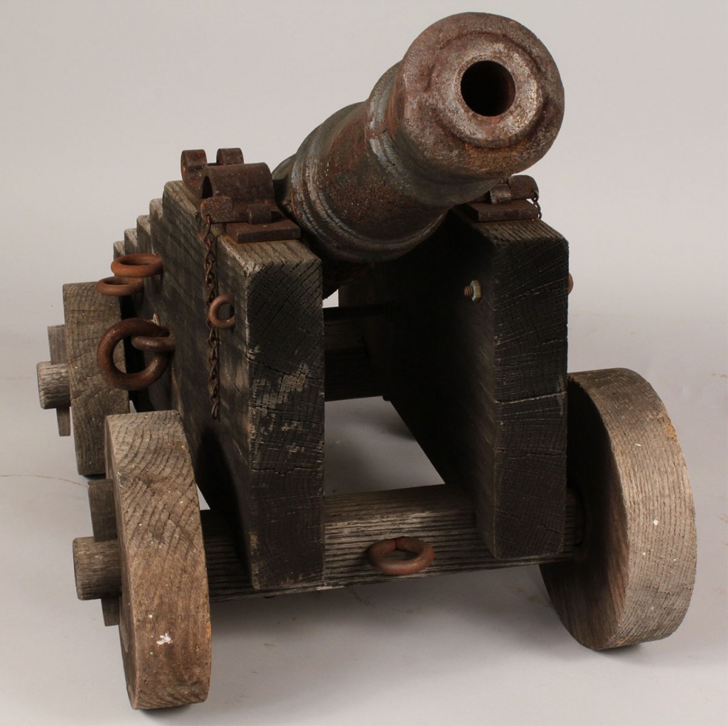 Lot 519: Small Iron cannon with oak carriage