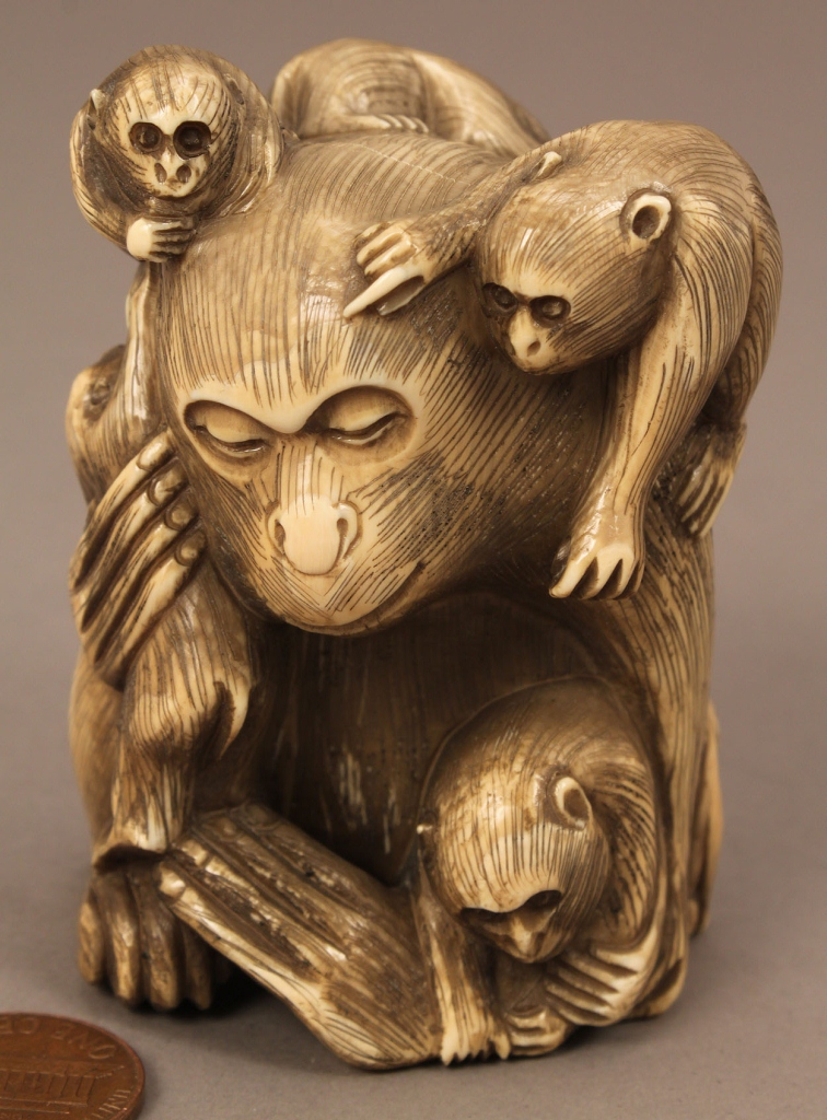 Lot 609: Large carved bone or ivory monkey netsuke