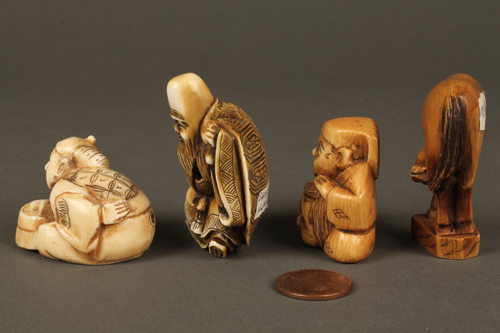 Lot 610: Four assorted carved ivory netsukes