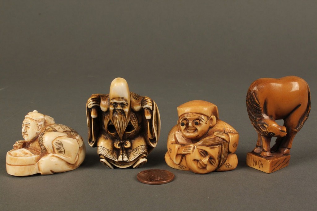 Lot 610: Four assorted carved ivory netsukes