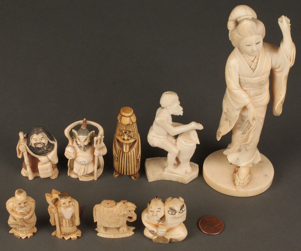 Lot 611: Group of 9 carved ivory items including netsukes