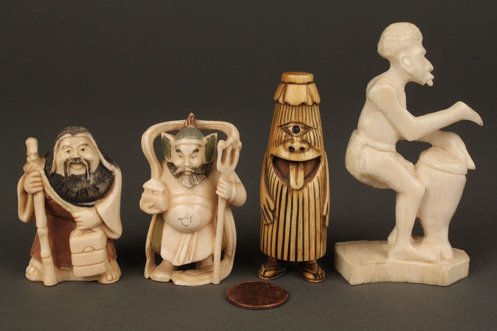 Lot 611: Group of 9 carved ivory items including netsukes