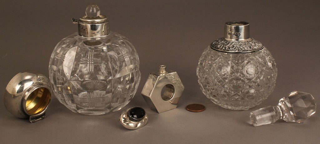 Lot 690: Three silver and glass perfume bottles