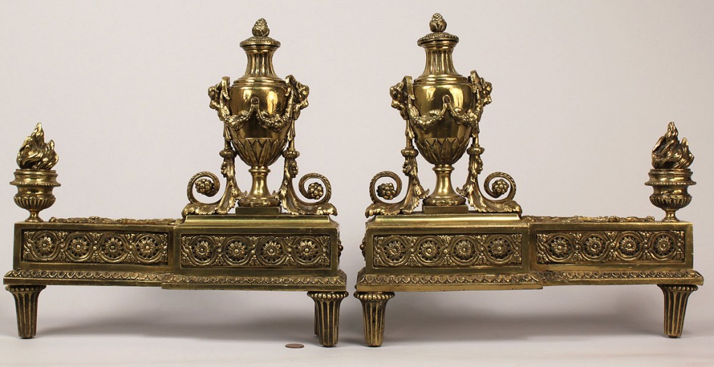 Lot 697: Pair of gilded fireplace chenets