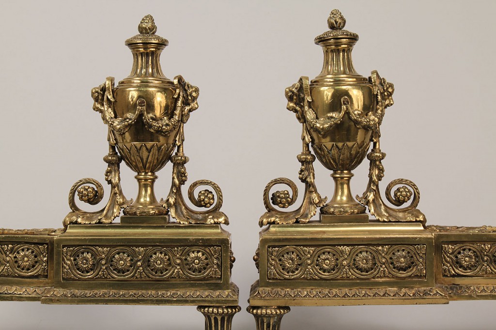Lot 697: Pair of gilded fireplace chenets