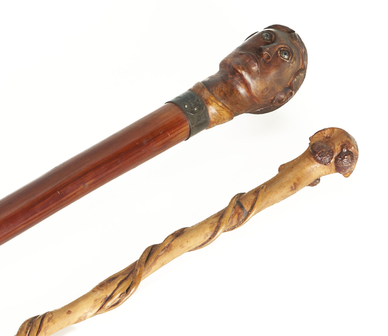 Lot 176: 2 Carved Walking Sticks incl. Glass Eye Figural