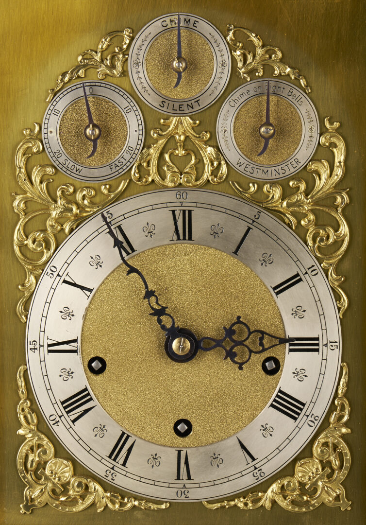 Lot 197: A Walnut and Brass Bracket Clock, Peerless