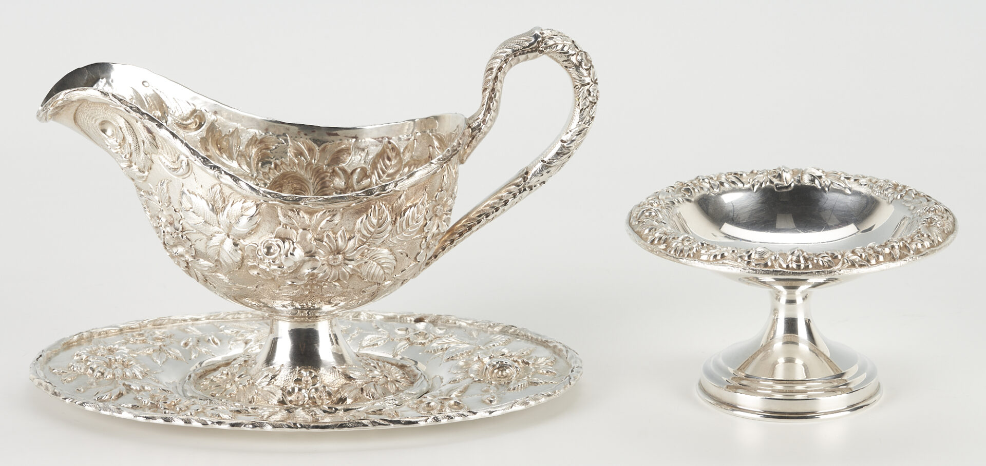 Lot 298: 9 Kirk Sterling Repousse Table Items incl. Gravy Boat, Hand Decorated