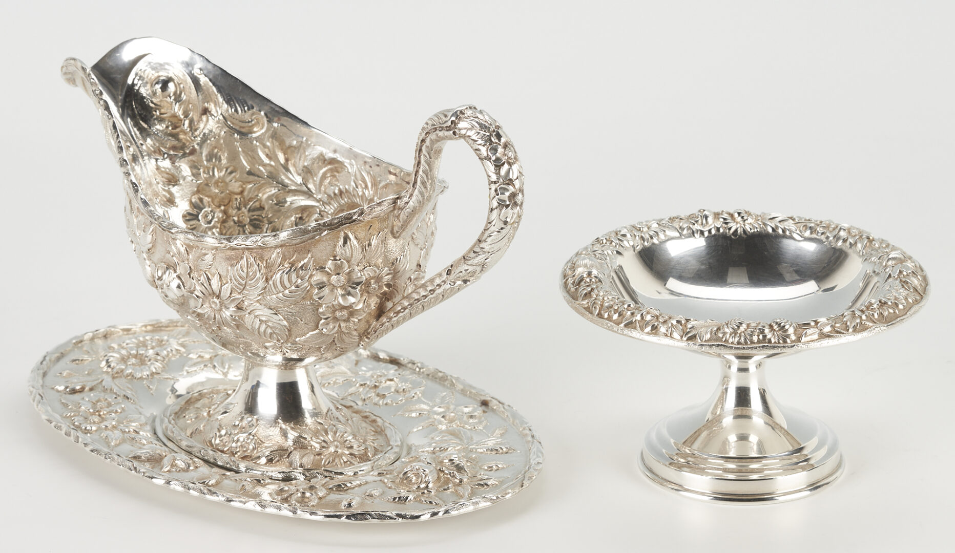 Lot 298: 9 Kirk Sterling Repousse Table Items incl. Gravy Boat, Hand Decorated