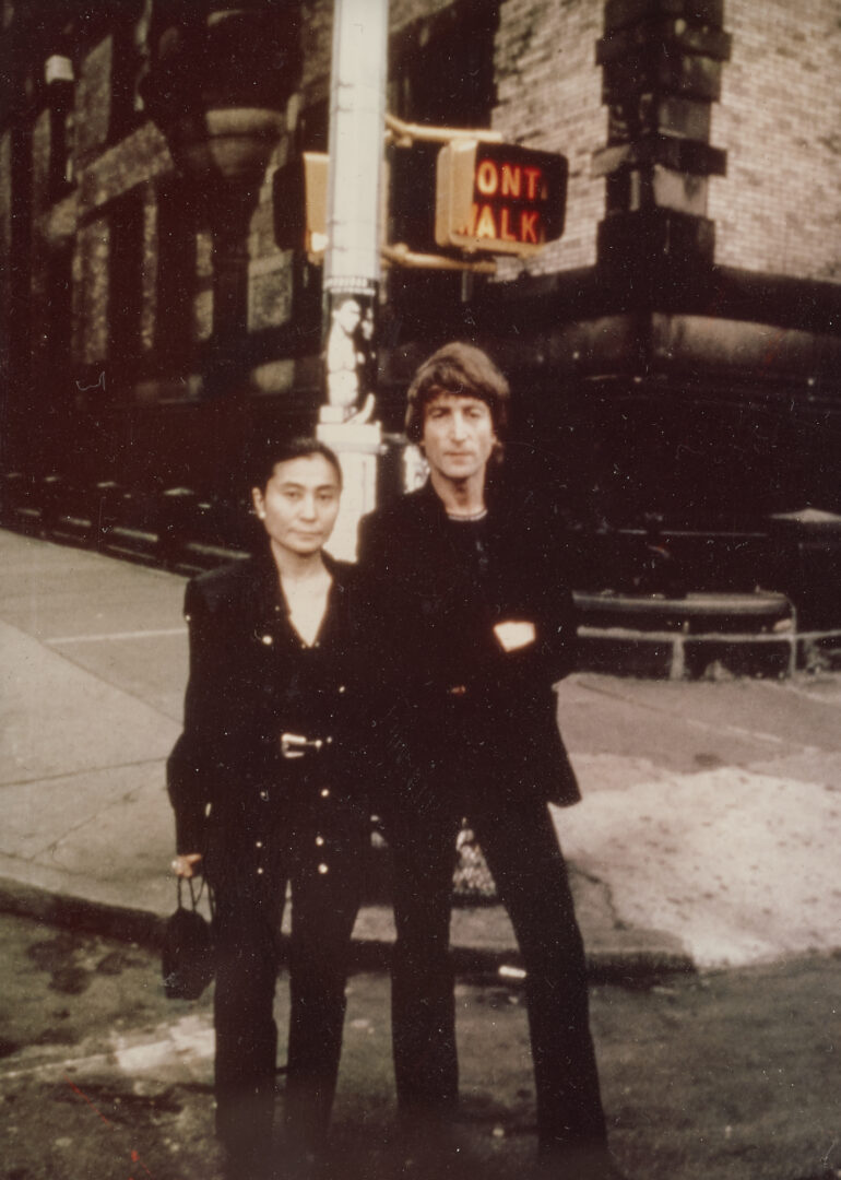 Lot 611: John Lennon Worn Jacket and Al Hirschfeld Litho in Shadowbox