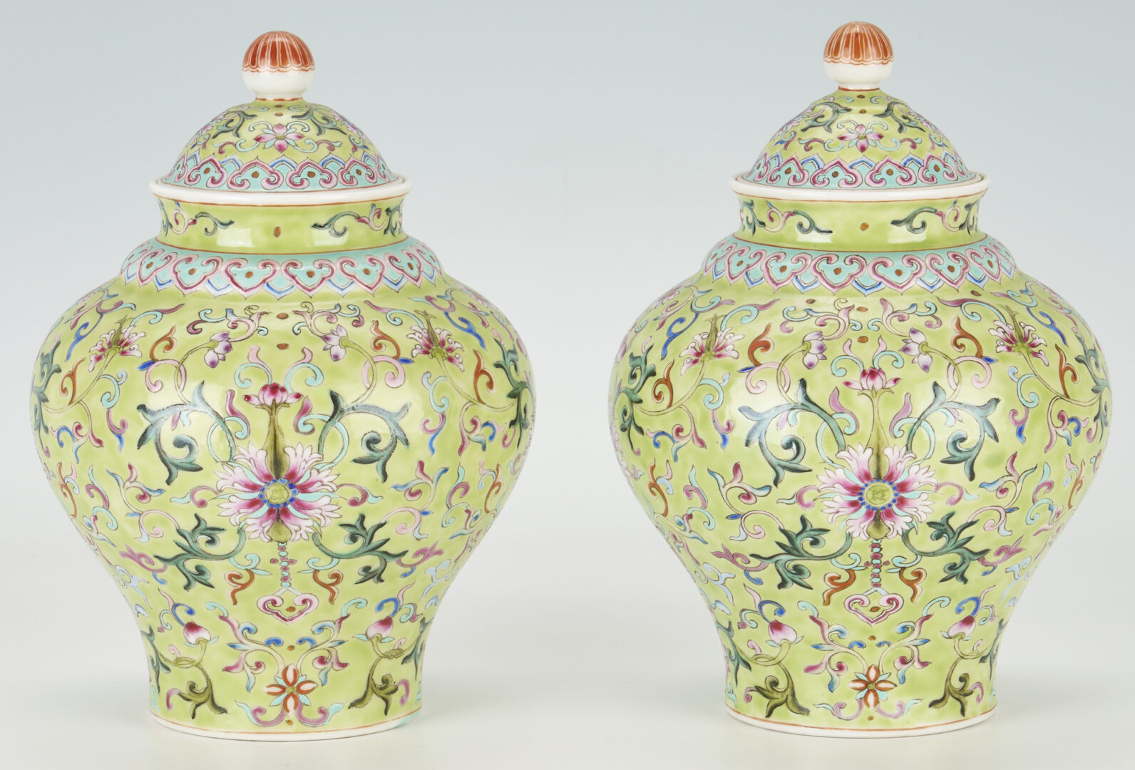 Lot 9: Pair of Chinese Lime Green Ground Famille Rose Jars