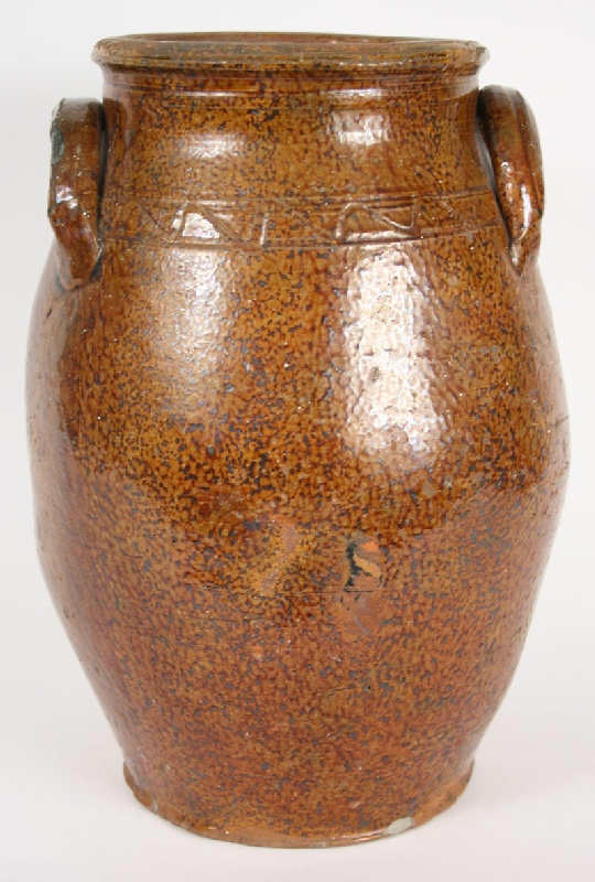 East Tennessee redware jar with sine wave incising. Attributed to Cain pottery. 19th century.